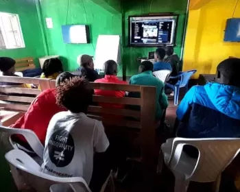 Members of the Kenya Fight Inequality Alliance learn how to spread their message online during a meeting in Nairobi. 